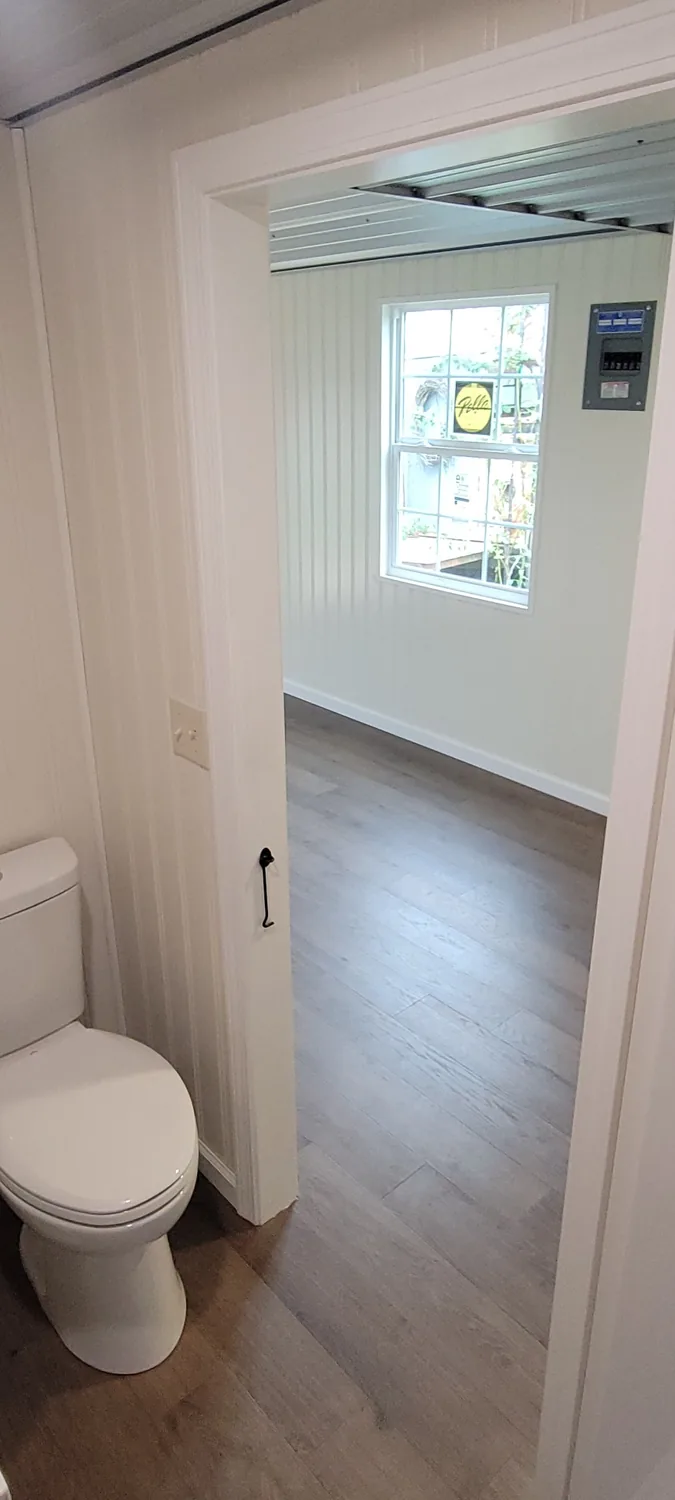 Basecamp Green bathroom looking back into the studio