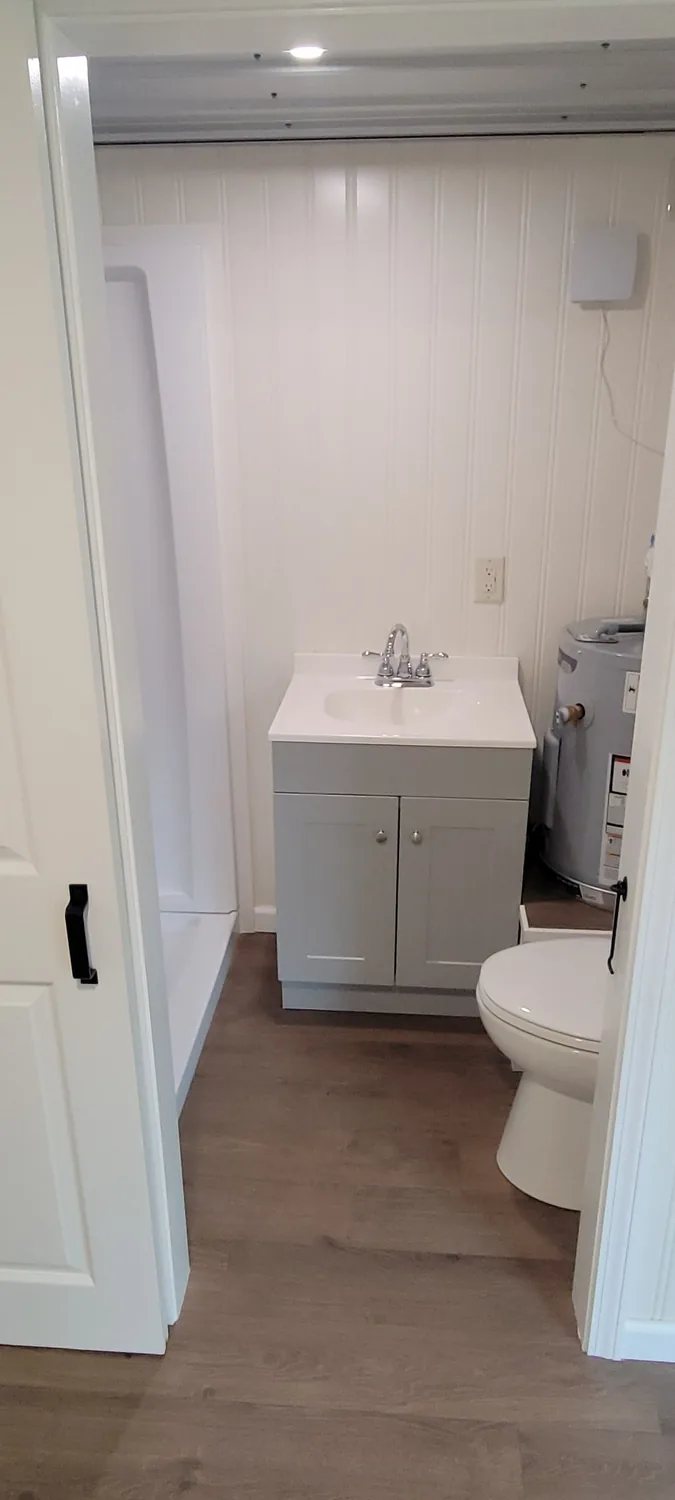 Basecamp Green bathroom vanity and toilet