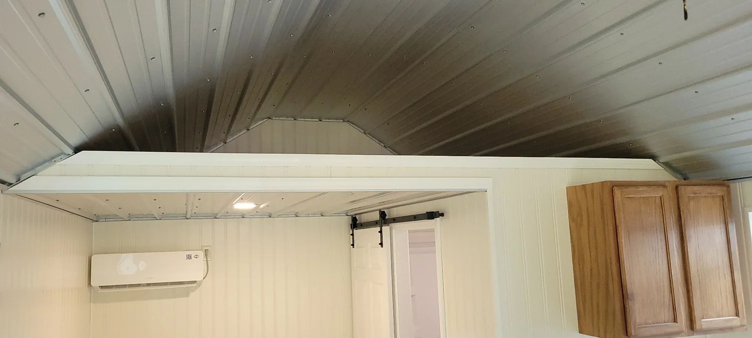 Basecamp Green vaulted metal ceiling