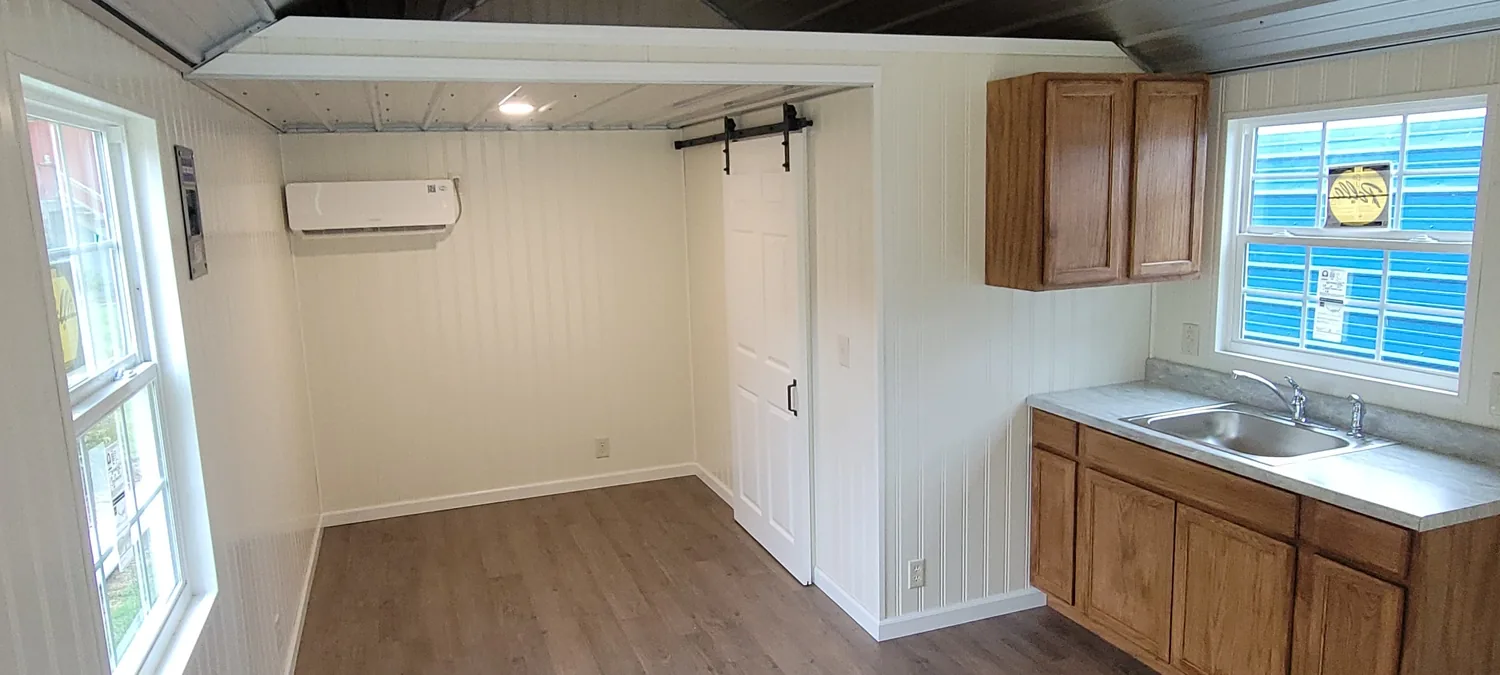 Basecamp Green wide interior with kitchen and sleeping area