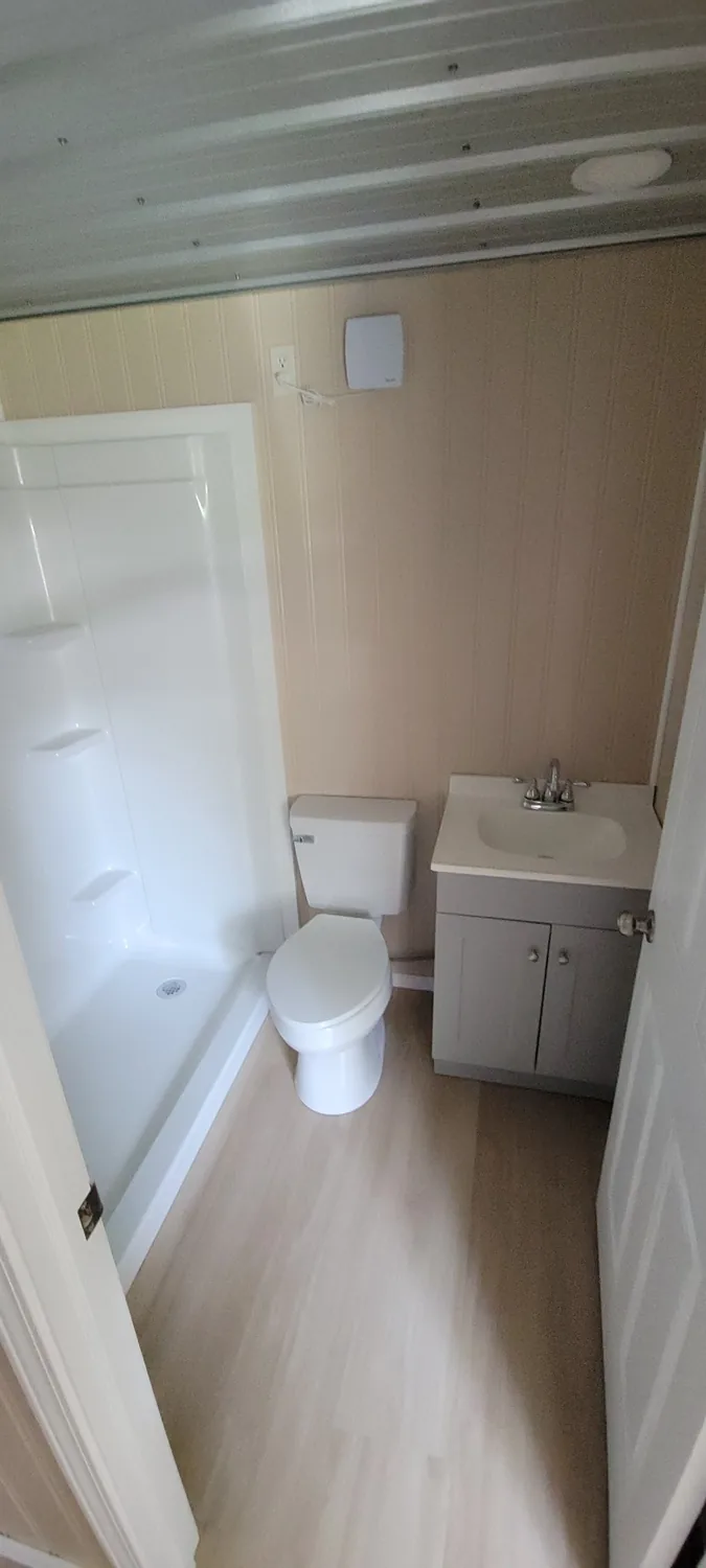 Homestead bathroom with shower, toilet and vanity